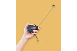 hand holding a tape measure - helping to identify one of the aspects of av mounting