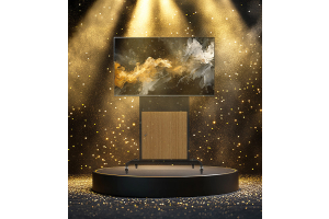 UNICOL's new Rhobus Plus AV Stand/Trolley in Sinterflex Black with an Oak effect door and large screen - stood on a podium, surrounded by sparkles, fog and 4 spotlights.
